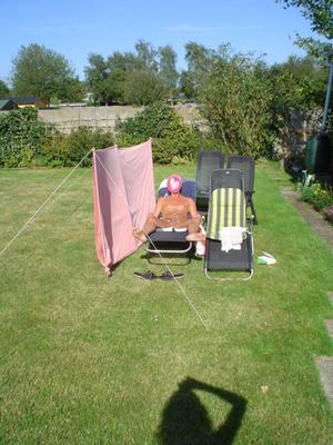 Hubby naked in our garden.