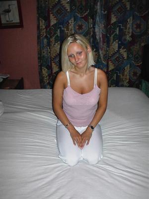 Blonde Norwegian in latex and boots