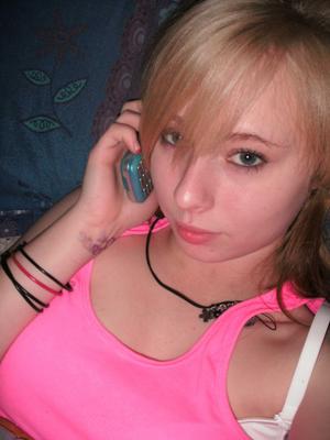 Sexy teen taking selfies in bed